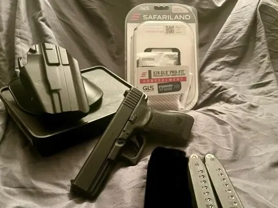 Glock 21 with LaserMax Red Guiderod laser, holster and extra magazines