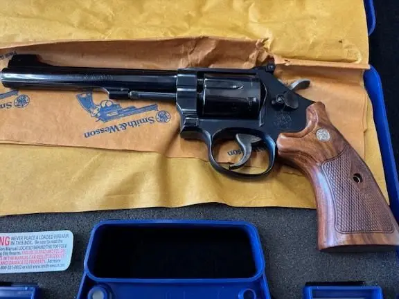 S&W model 48-7 .22 wmr revolver, EXIB, 6 shot, 6" bbl, factory wood grips & box, $875 cash. 4O5-596-4583 in Broken Arrow