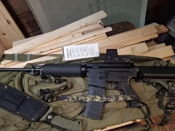 AR15 with EOTECH sight 3 point sling and machete
