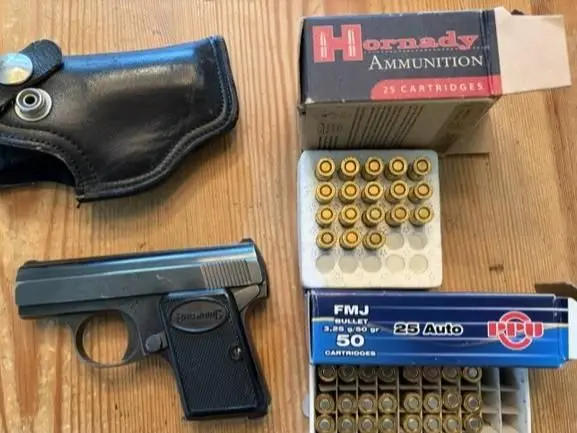 Baby Browning .25 cal Pistol with holster and ammunition
