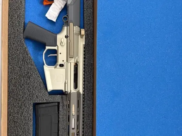 New never fired Q Honey Badger .300 black out