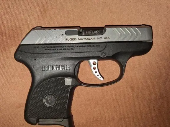 RUGER LCP STAINLESS 380 LIKE NEW WITH AMMO .CASE.