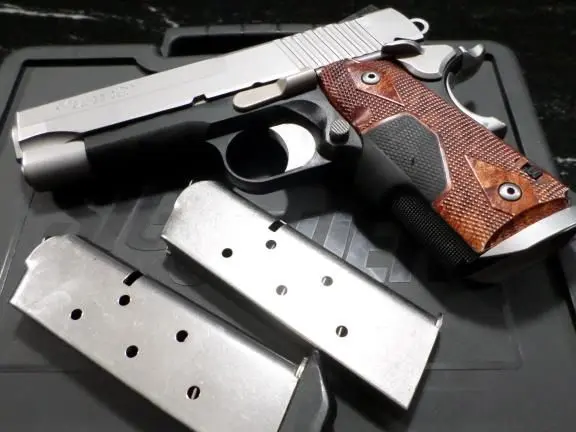Sig Sauer 1911 C3 45 acp with Red Crimson Trace grip and Night Sights