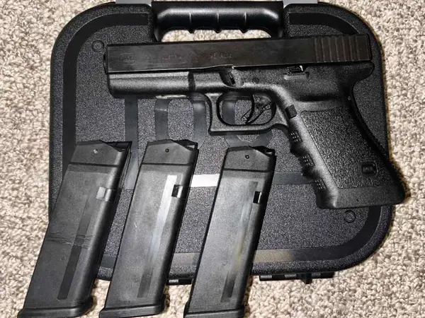 Glock 21 with three magazines