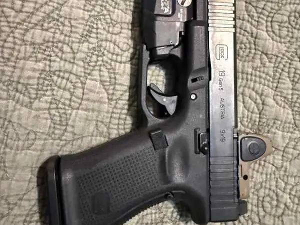 Glock 19 with trijicon and light
