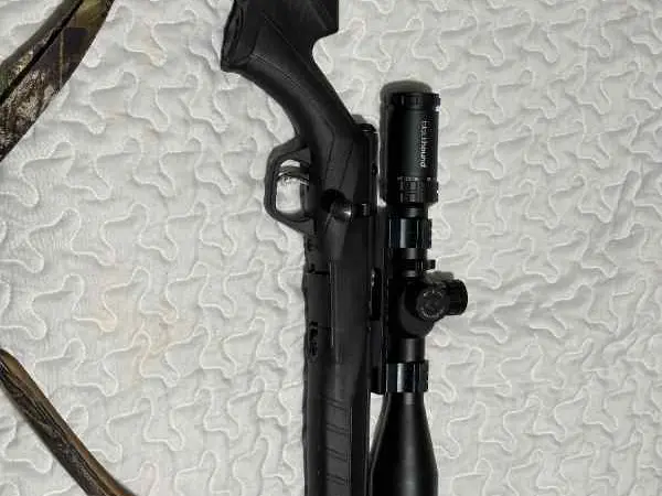 Savage 22 rifle with scope