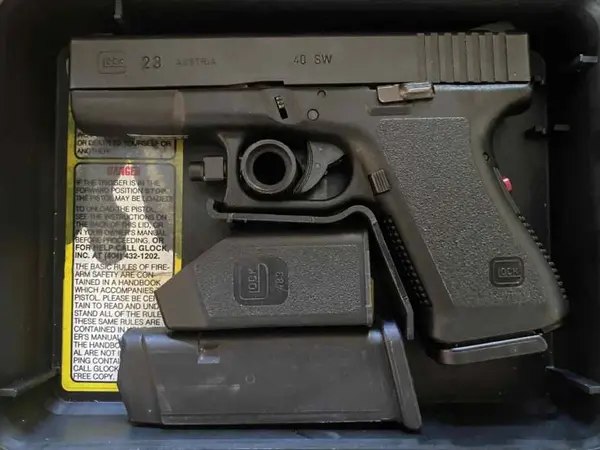 Glock 23 Gen 2 with factory red dot laser
