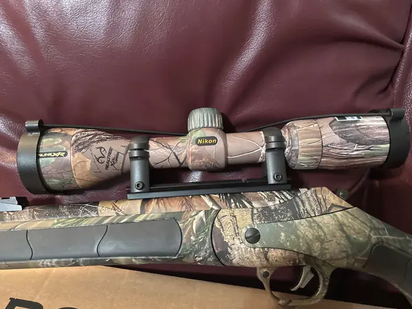 Thompson Center Triumph Bone Collector 50 Caliber Muzzleloader W/Nikon Scope